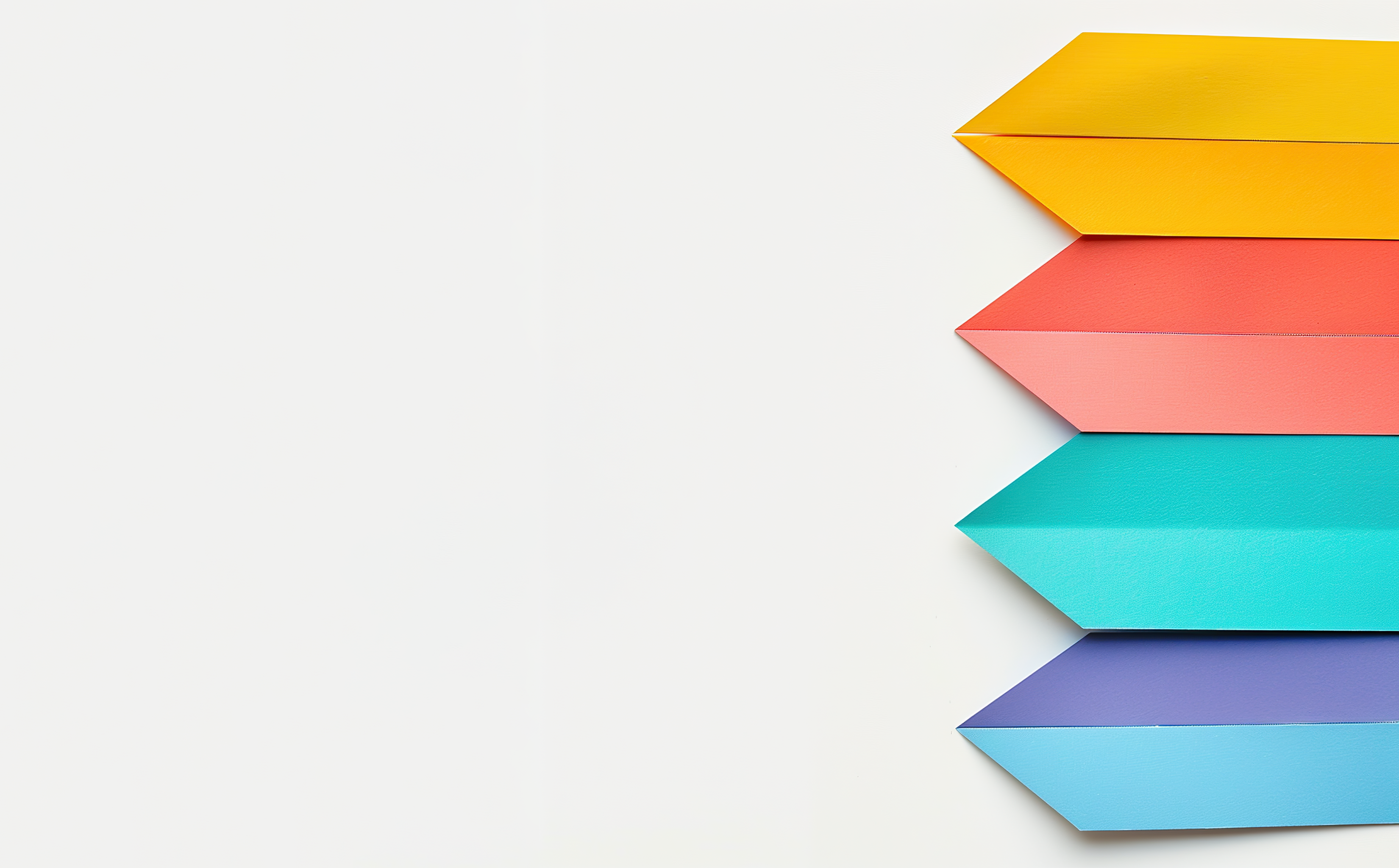 Colored paper cutted arrows, cutted from different colors with white background