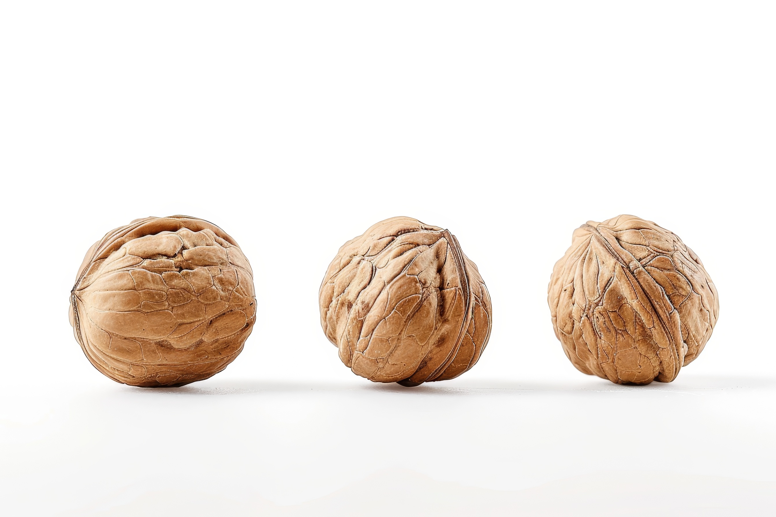 Three walnuts isolated on white background