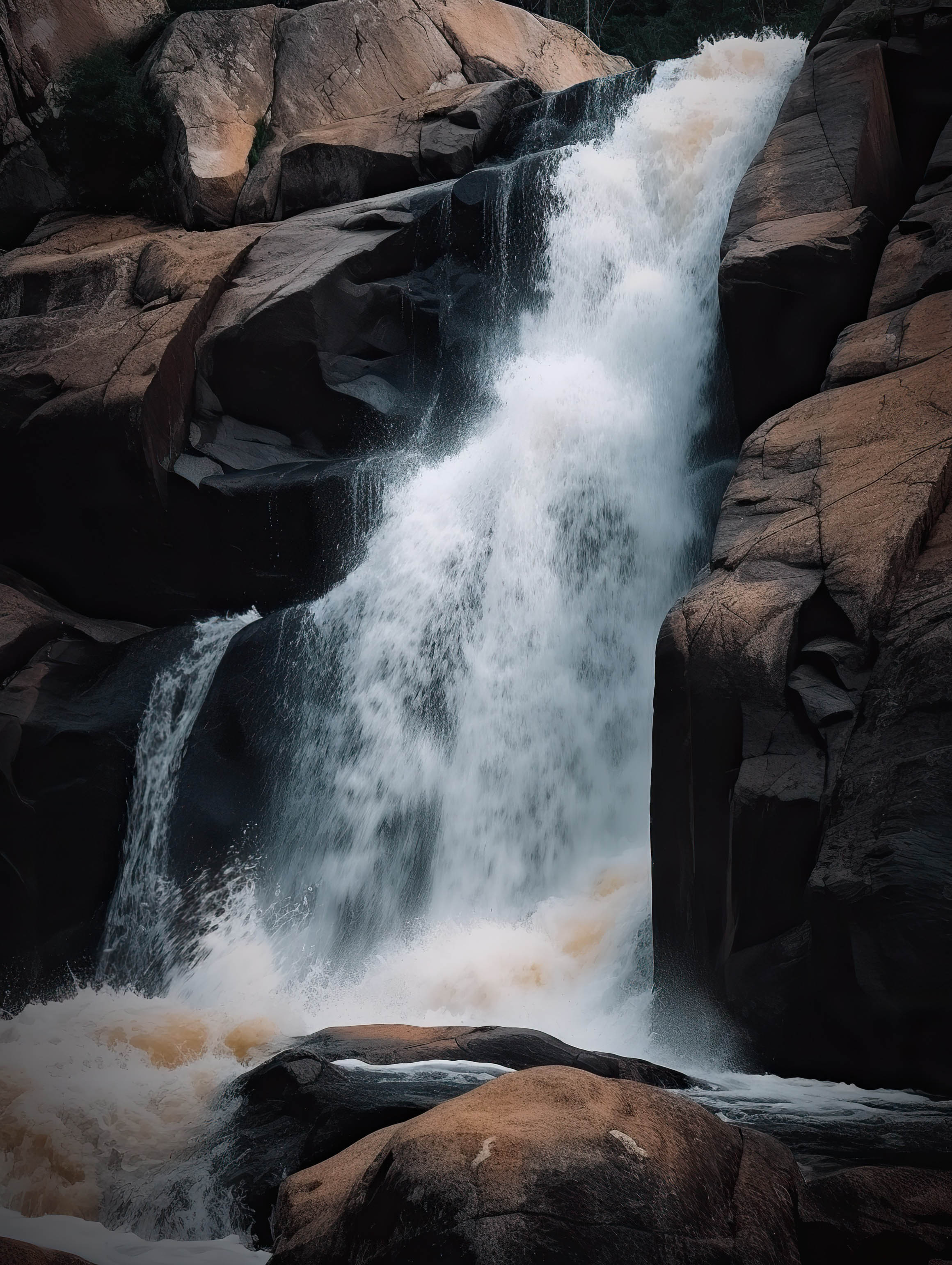 Waterfall cascading down a rocky cliff face