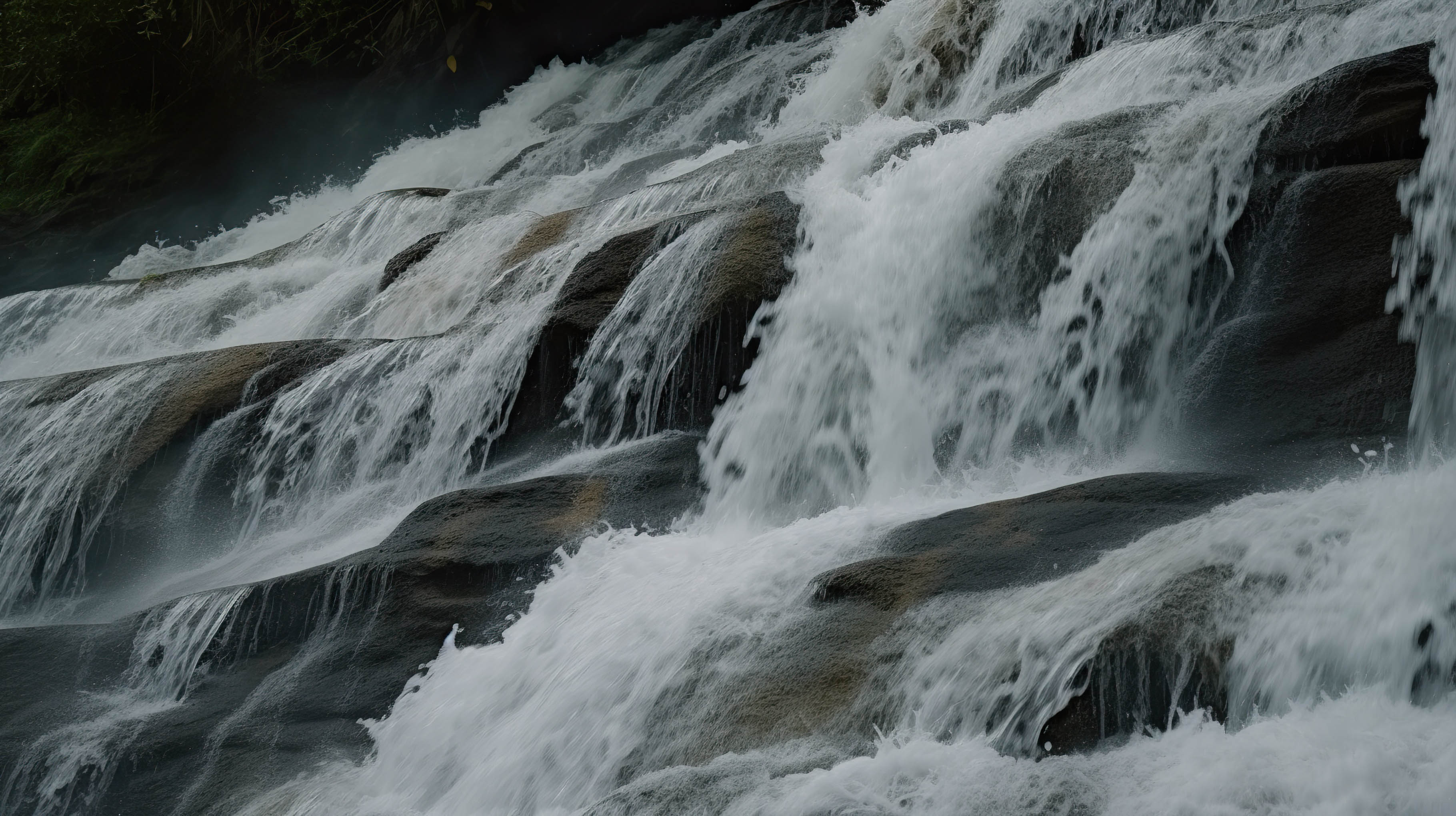 Waterfall cascading down a rocky cliff face